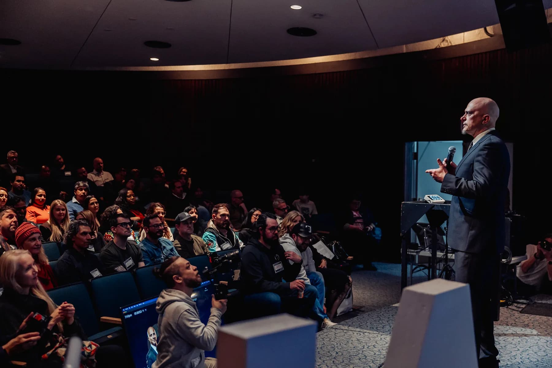 Wide Space Centre auditorium with a speaker and full Vancouver AI audience