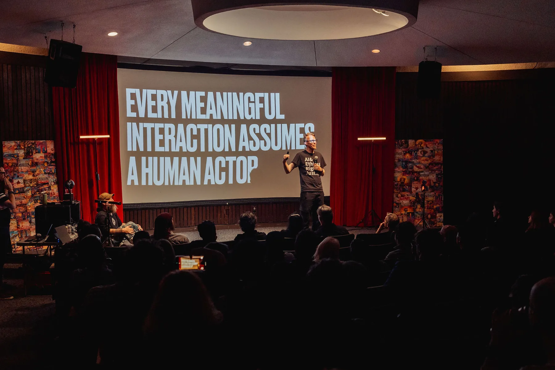 Auditorium talk with a slide about meaningful human interaction